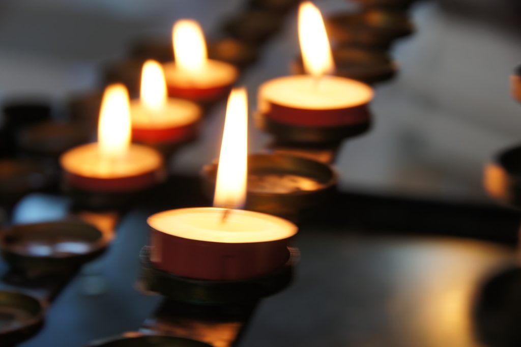 a row of lit candles - personal injury claim