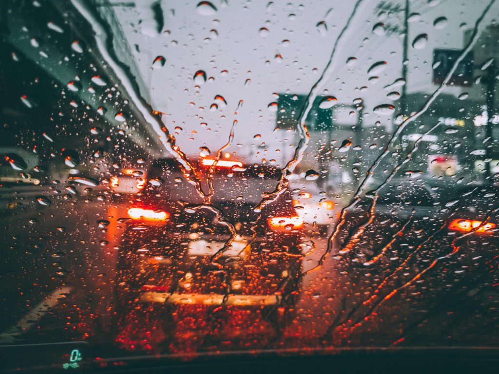 a view of a road through a car window - Car Accident Injuries